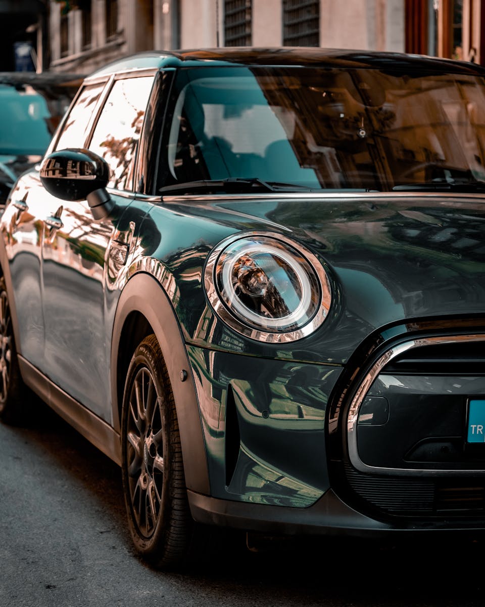 A BMW Mini Parked on the Side of a Street